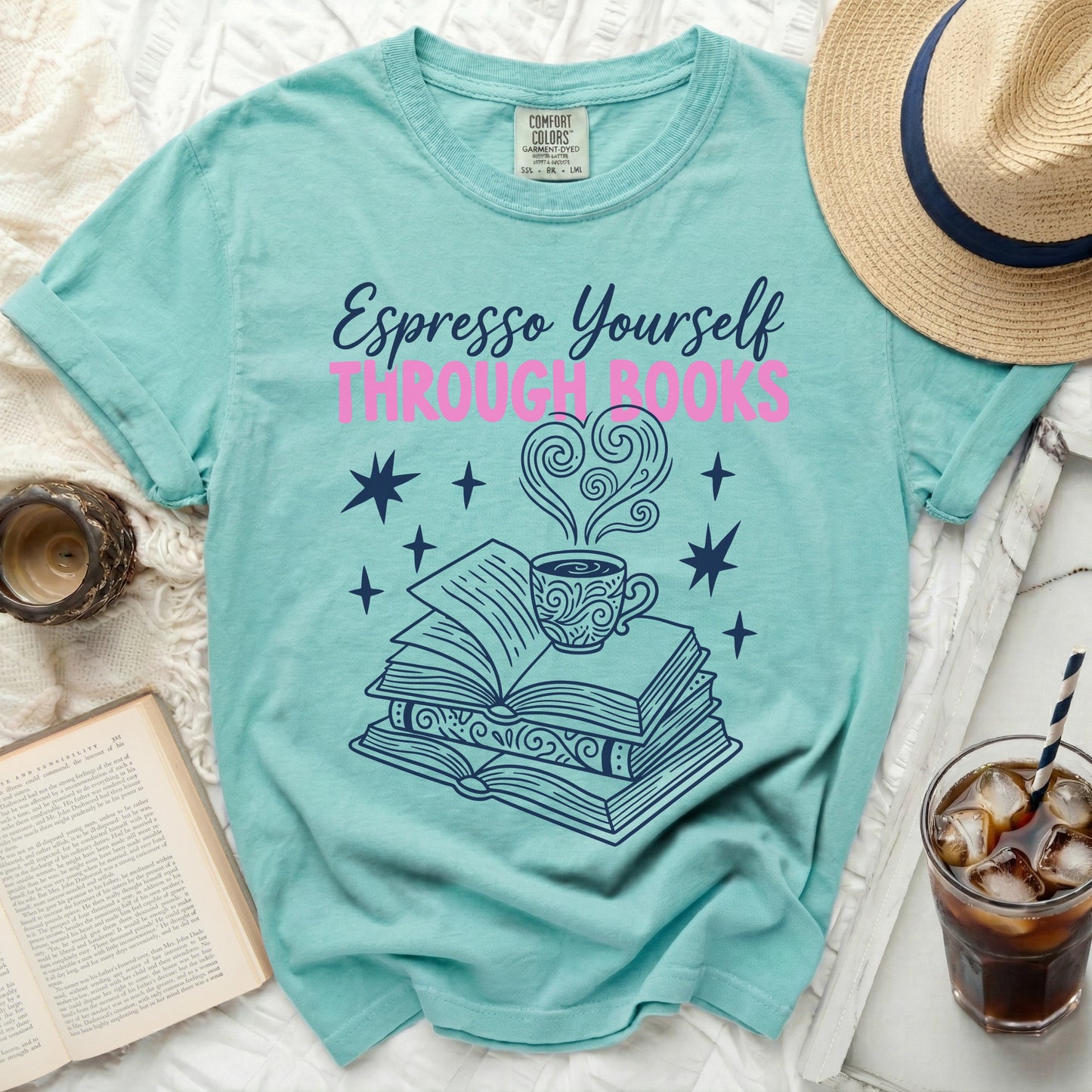 Teal t-shirt with "Espresso Yourself Through Books" text and book graphic.