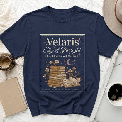 Navy t-shirt with "Velaris City of Starlight" text and book illustration.