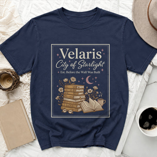 Navy t-shirt with "Velaris City of Starlight" text and book illustration.