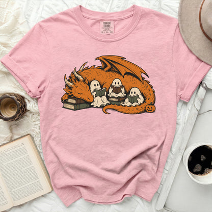 Pink t-shirt with dragon and ghosts reading books graphic.