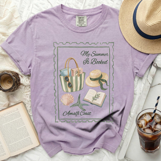 Purple t-shirt with "My Summer Is Booked Amalfi Coast" graphic.