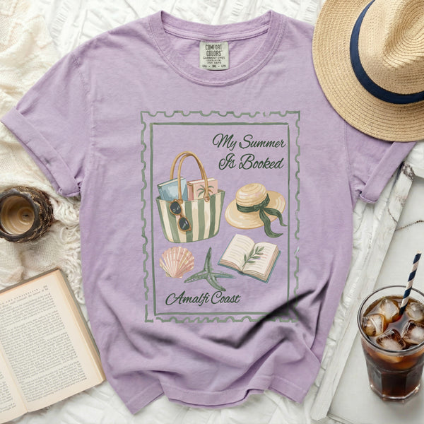 Purple t-shirt with "My Summer Is Booked Amalfi Coast" graphic.