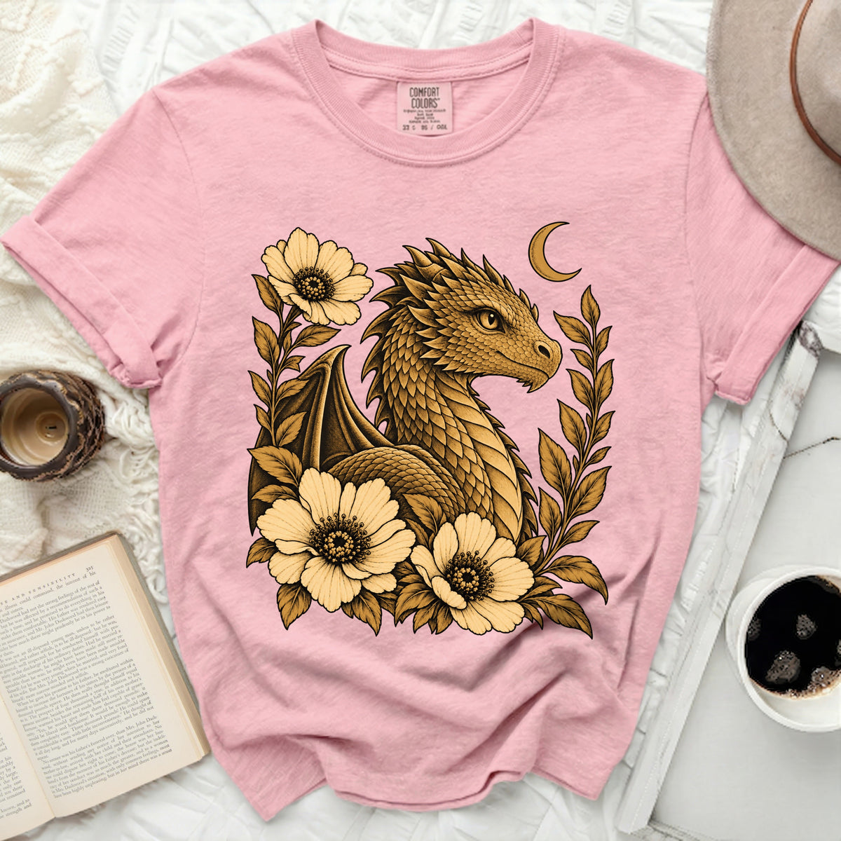 Pink t-shirt featuring a golden dragon with flowers and a crescent moon design.