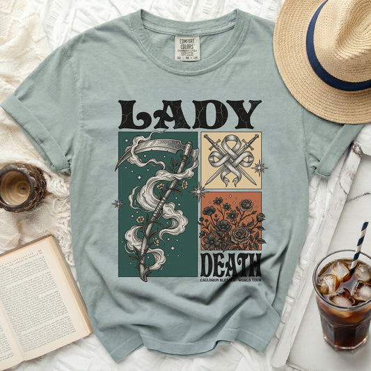 T-shirt with Lady Death graphic, scythe, swords, and roses.