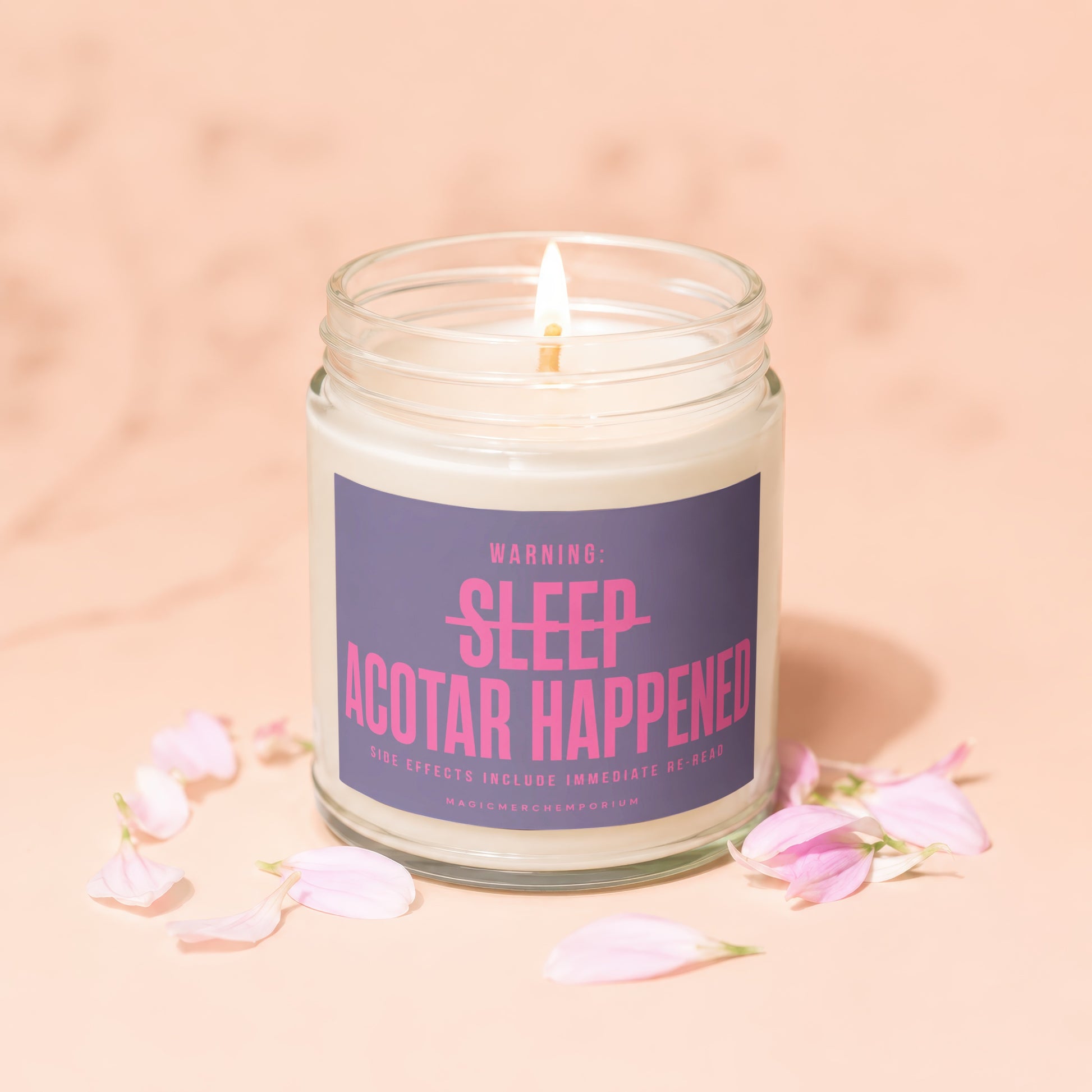 Lit candle with label "WARNING: SLEEP ACOTAR HAPPENED" surrounded by pink petals.