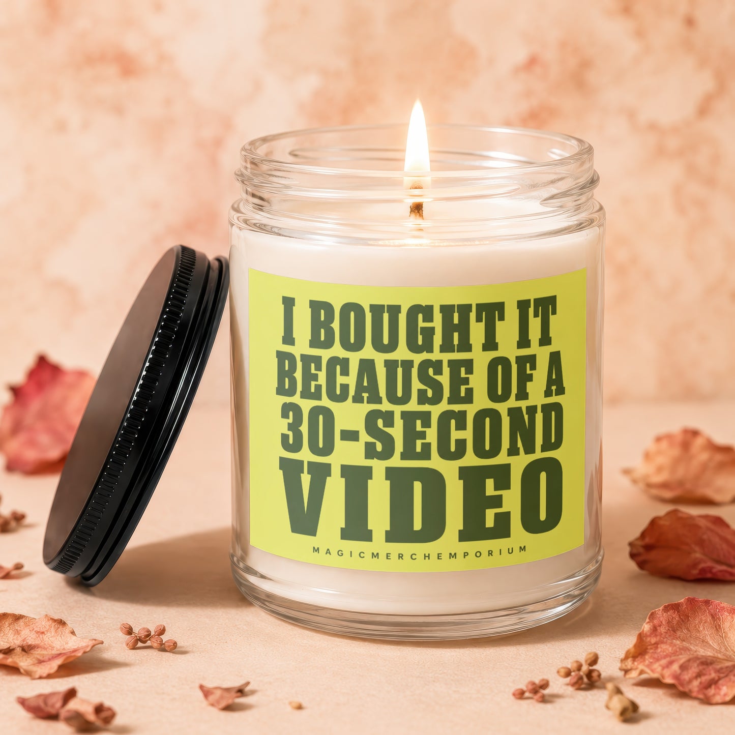 Candle with text "I BOUGHT IT BECAUSE OF A 30-SECOND VIDEO" and "MAGICMERCH"