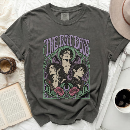 Dark gray t-shirt with "THE BAT BOYS" text and three dark-haired characters in art nouveau style.