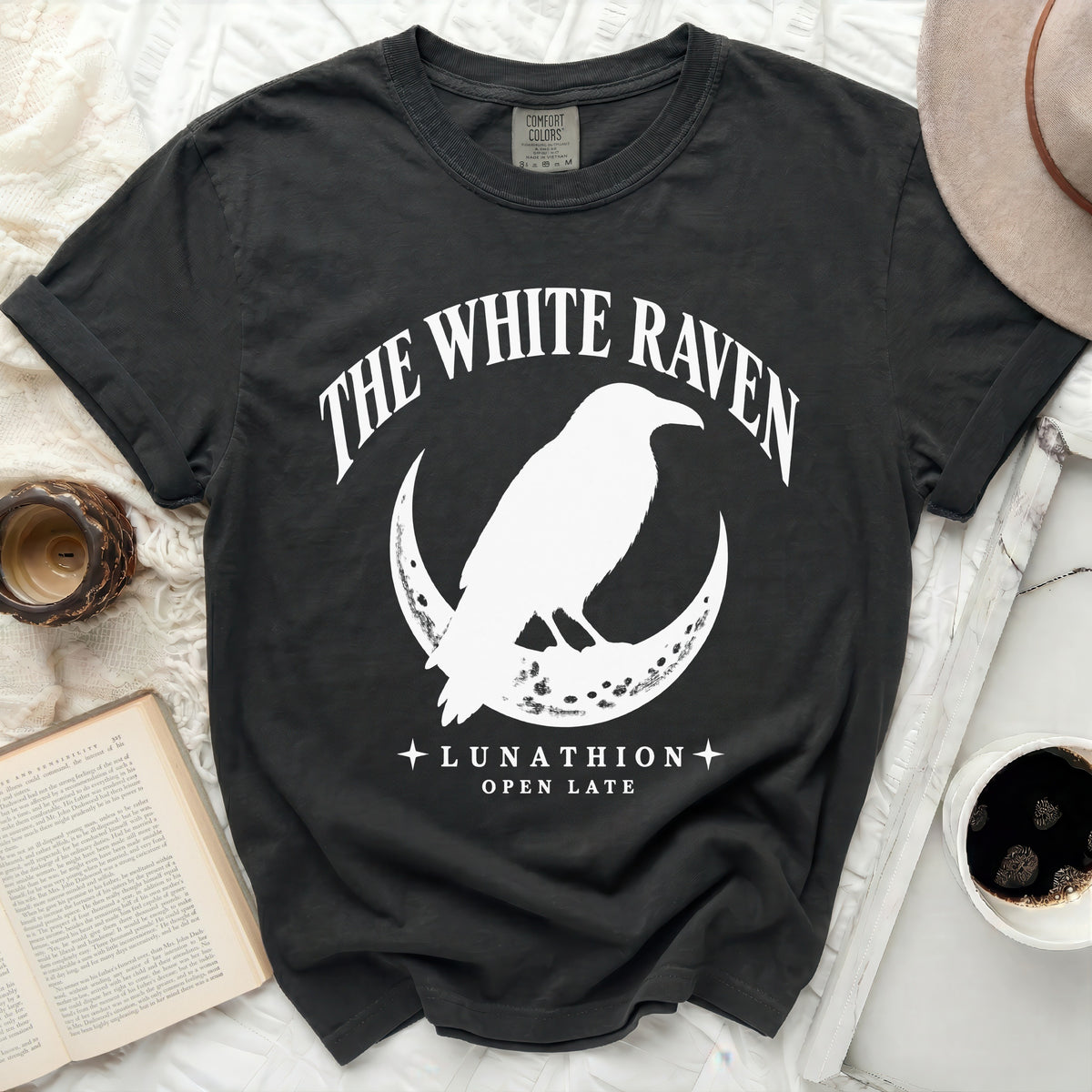Dark grey t-shirt with white raven on crescent moon and text.