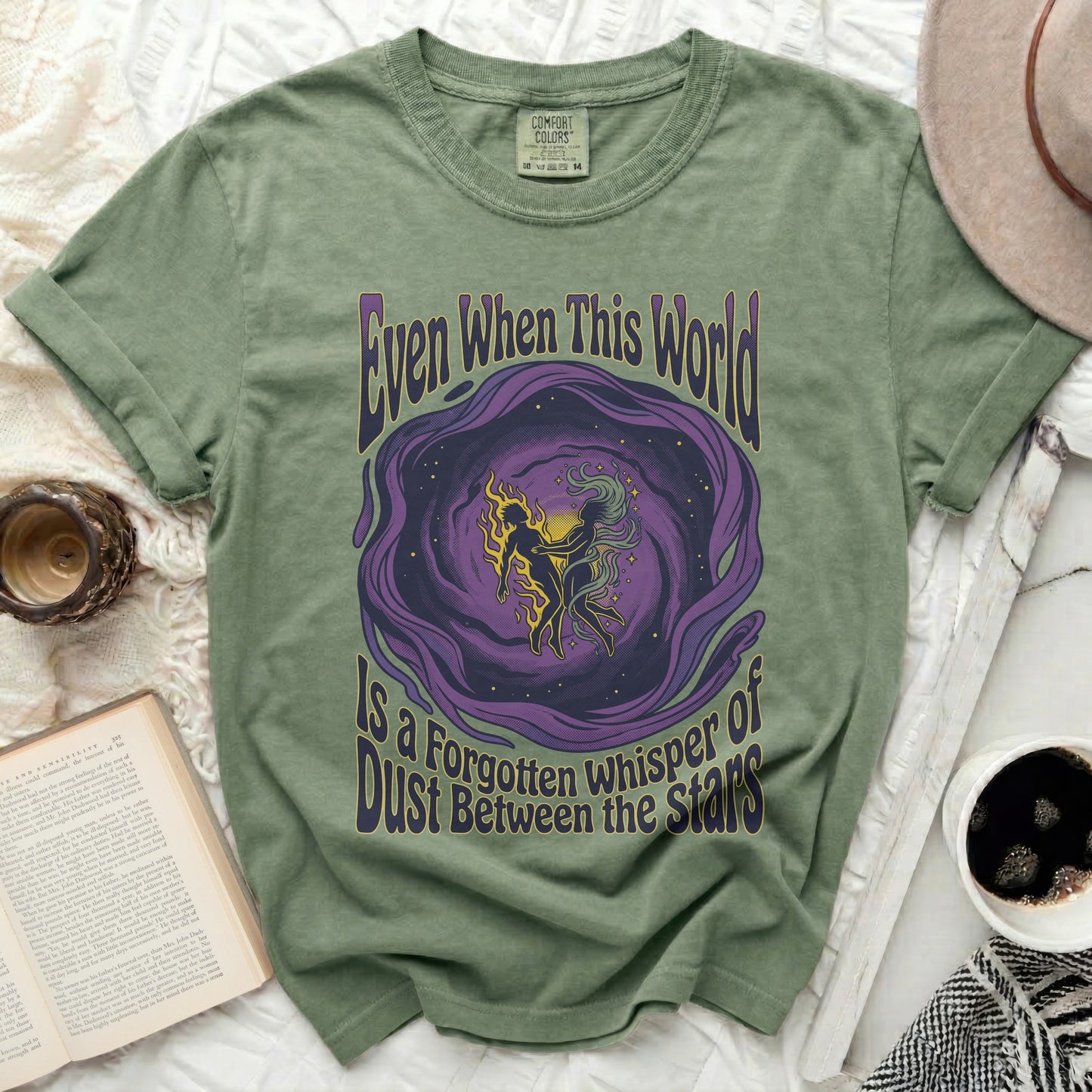 T-shirt with purple and gold swirling galaxy art and text.