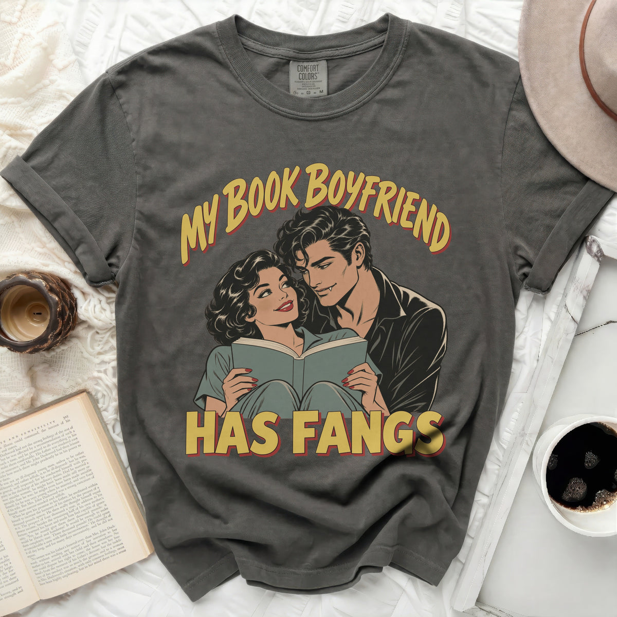 Grey t-shirt with "My Book Boyfriend Has Fangs" text and vintage comic illustration.