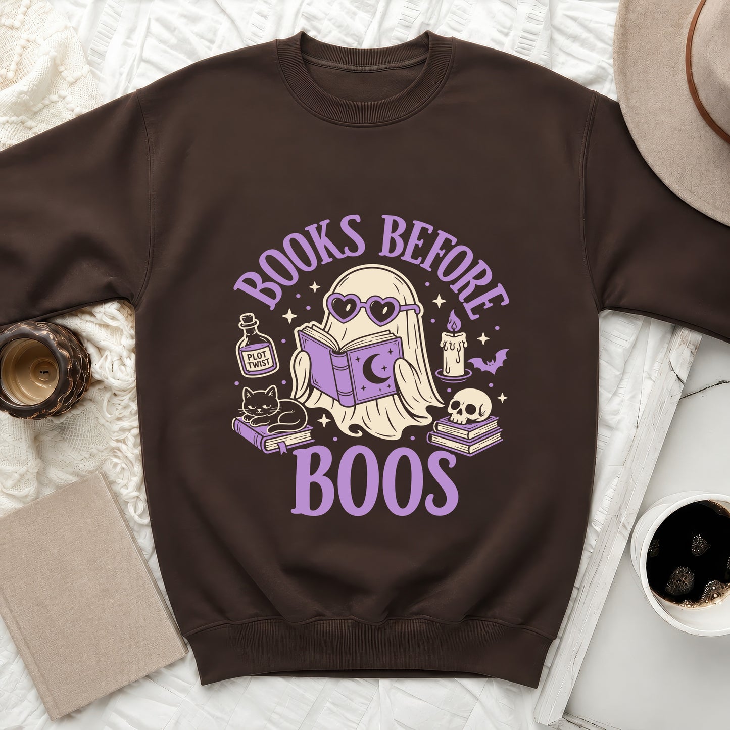 Brown sweatshirt with "Books Before Boos" text and ghost reading a book design.