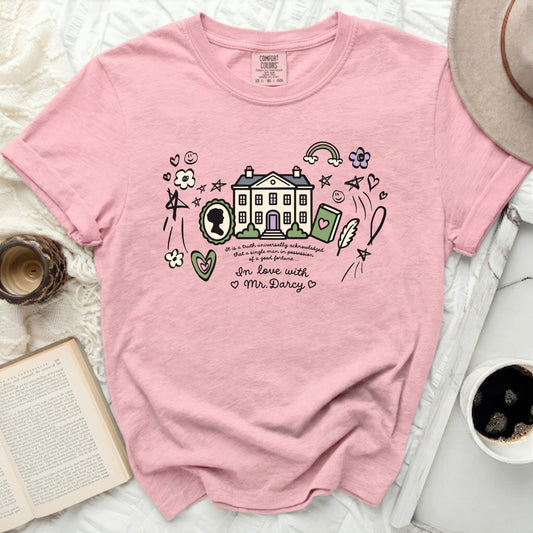 Pink Comfort Colors shirt with "In love with Mr. Darcy" and Austen-themed illustrations.