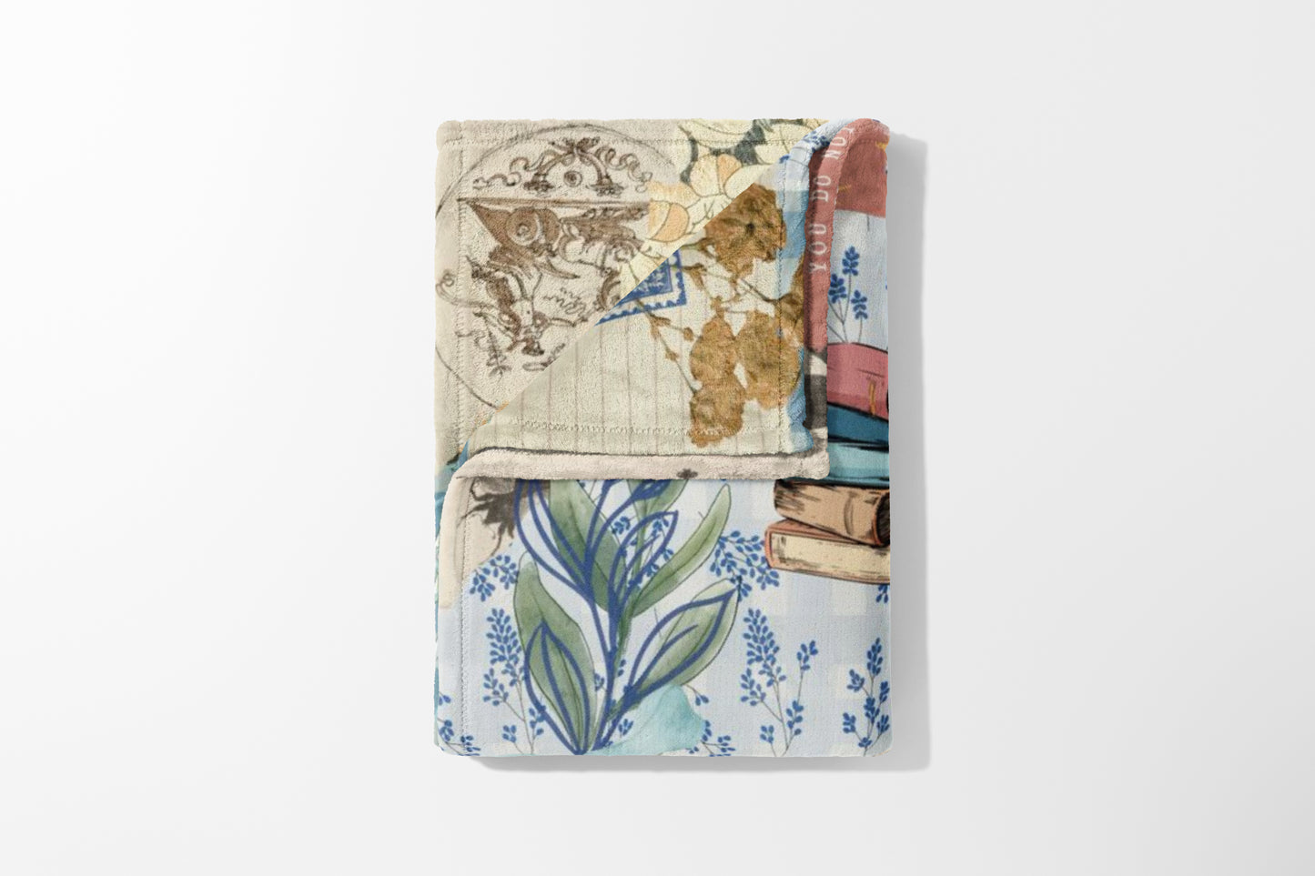 Collage blanket with antique scrolls, books, and floral blue patterns.