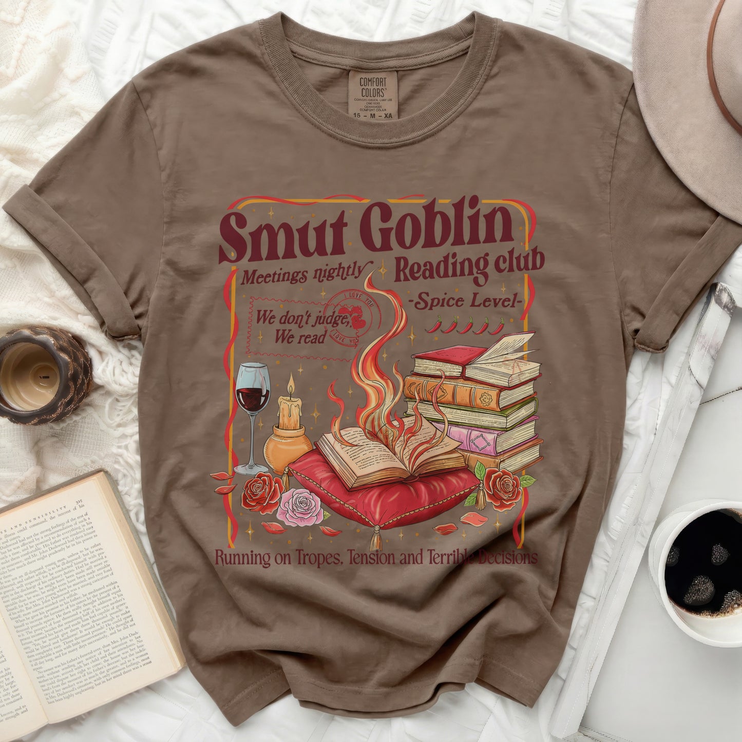 Smut Goblin Reading Club t-shirt with stacked books and flames graphic.