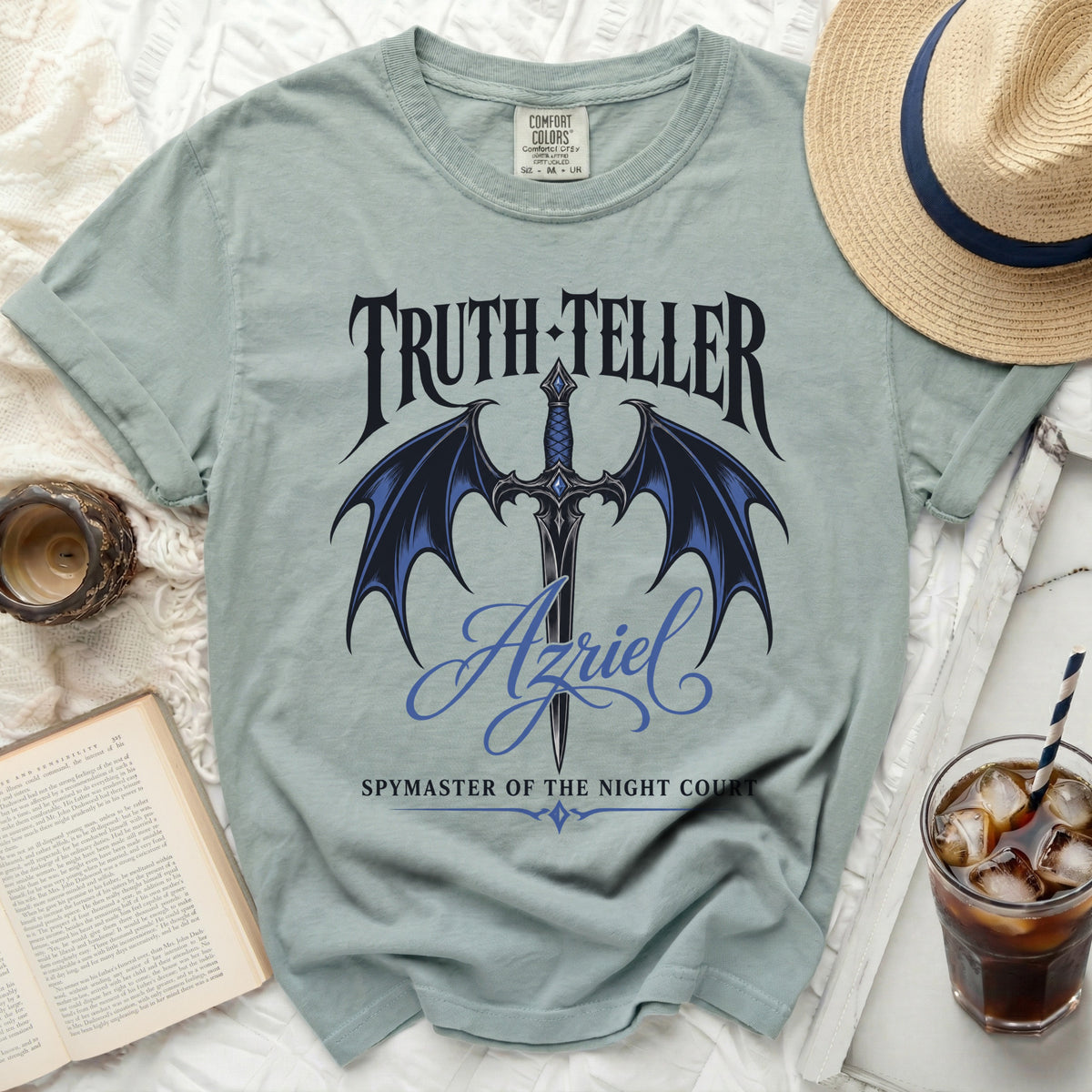 Light blue t-shirt with "Truth-Teller Azriel Spymaster of the Night Court" text and dragon wings.