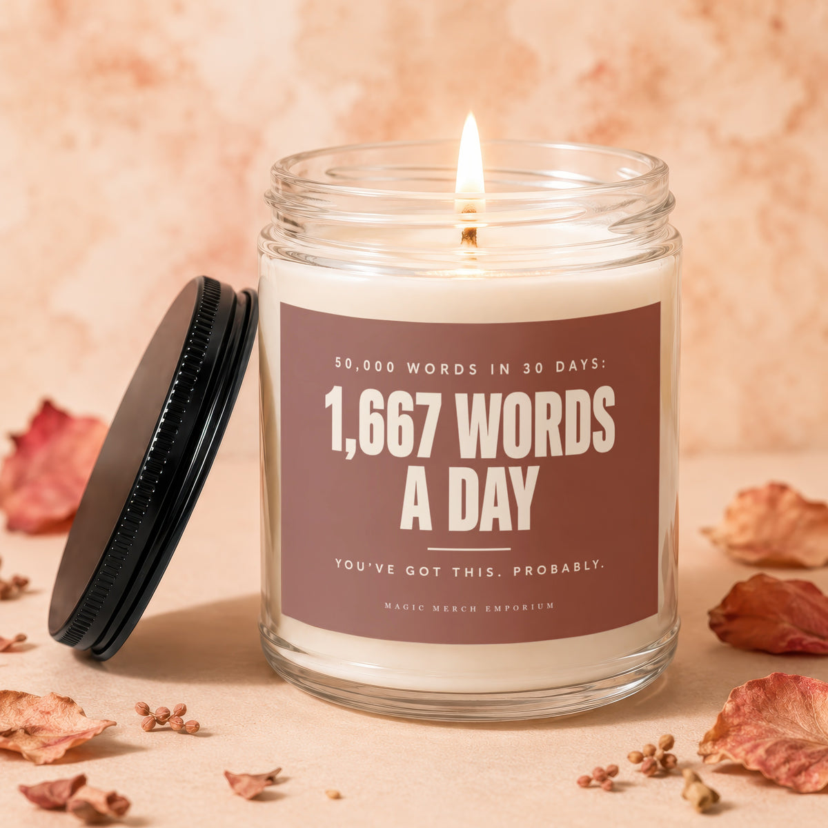Candle with "1,667 Words A Day" text and a lit wick.