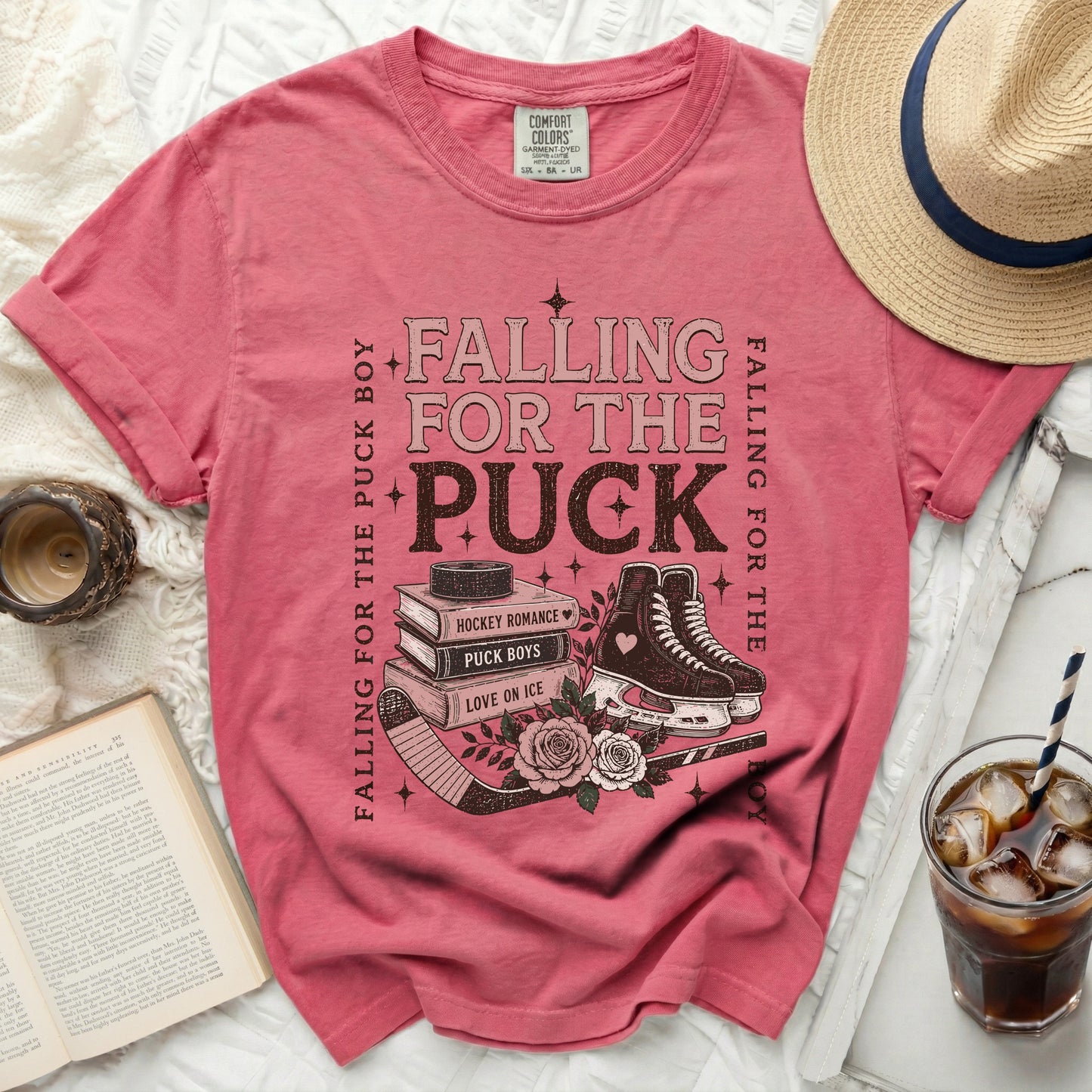 Pink t-shirt with "Falling for the Puck Boy" text and hockey imagery.