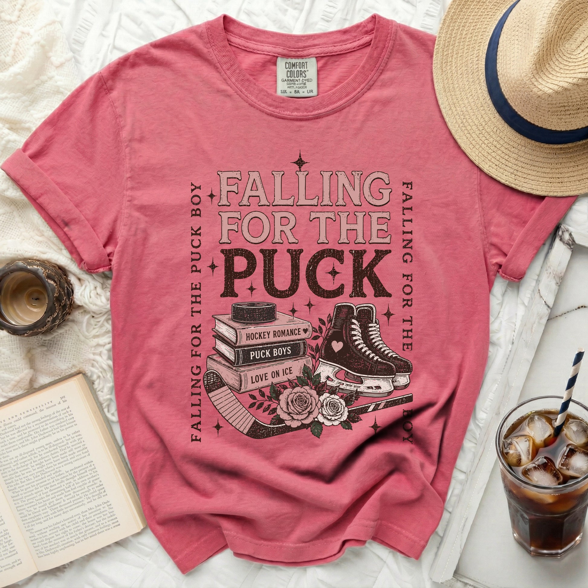 Pink t-shirt with "Falling for the Puck Boy" text and hockey imagery.