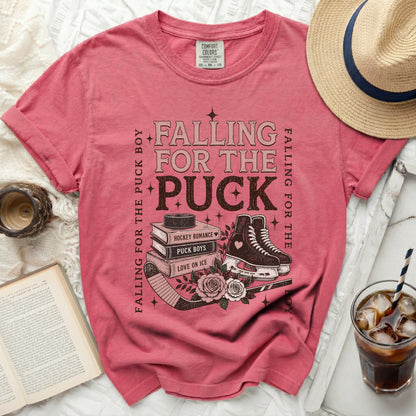 Pink t-shirt with "Falling for the Puck Boy" text and hockey imagery.