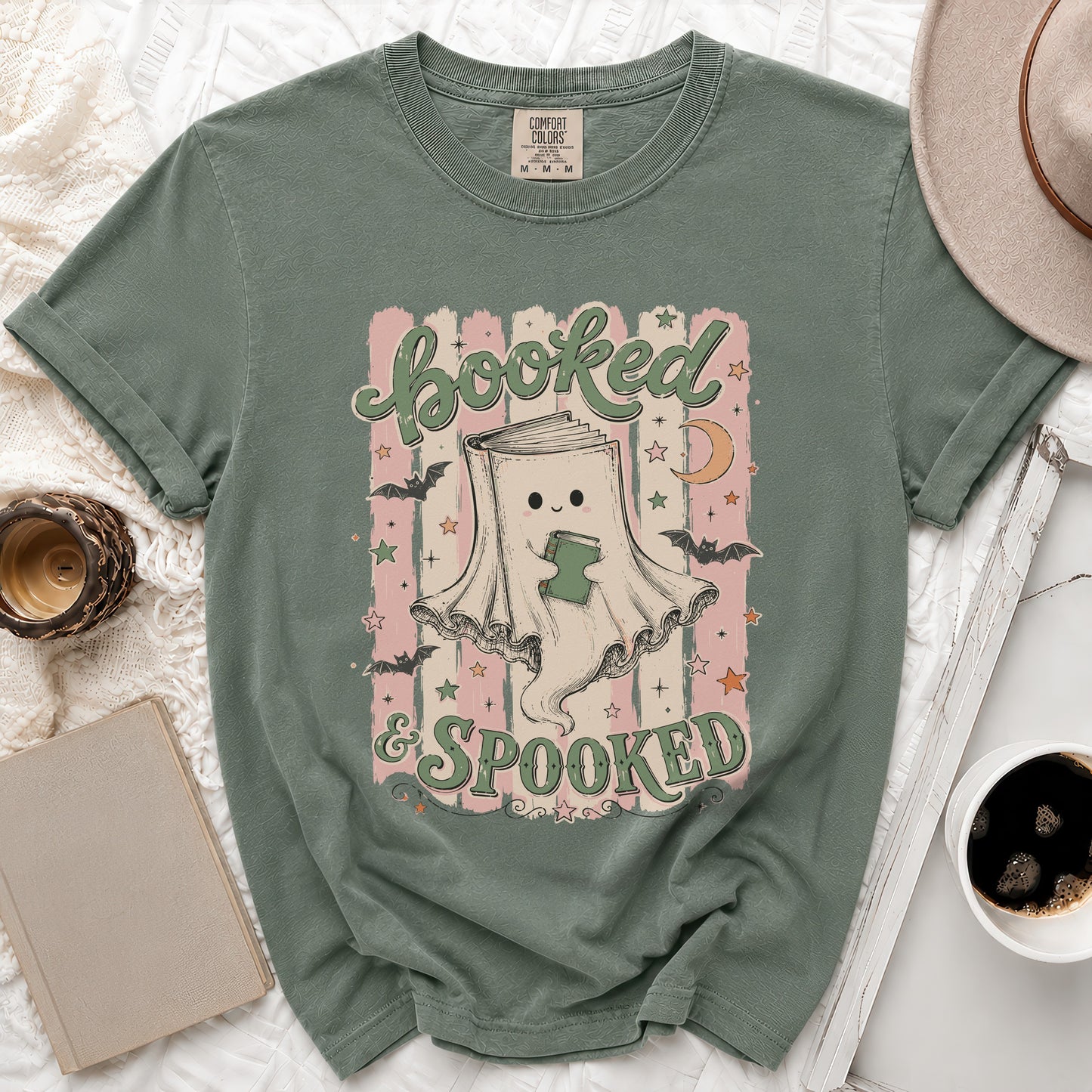 Green t-shirt with graphic "Booked & Spooked" and a ghost holding a book.