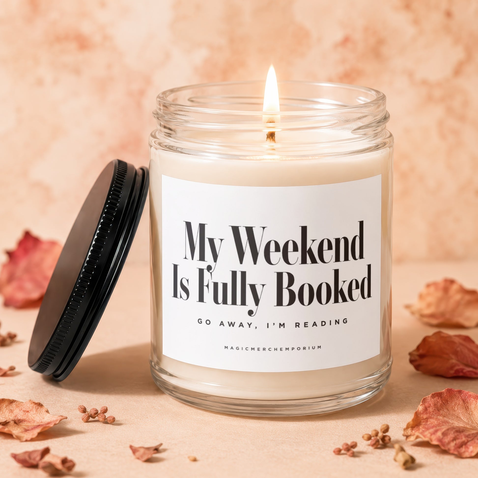Jar candle with label "My Weekend Is Fully Booked. Go Away, I'm Reading."