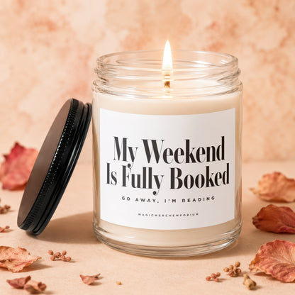Jar candle with label "My Weekend Is Fully Booked. Go Away, I'm Reading."