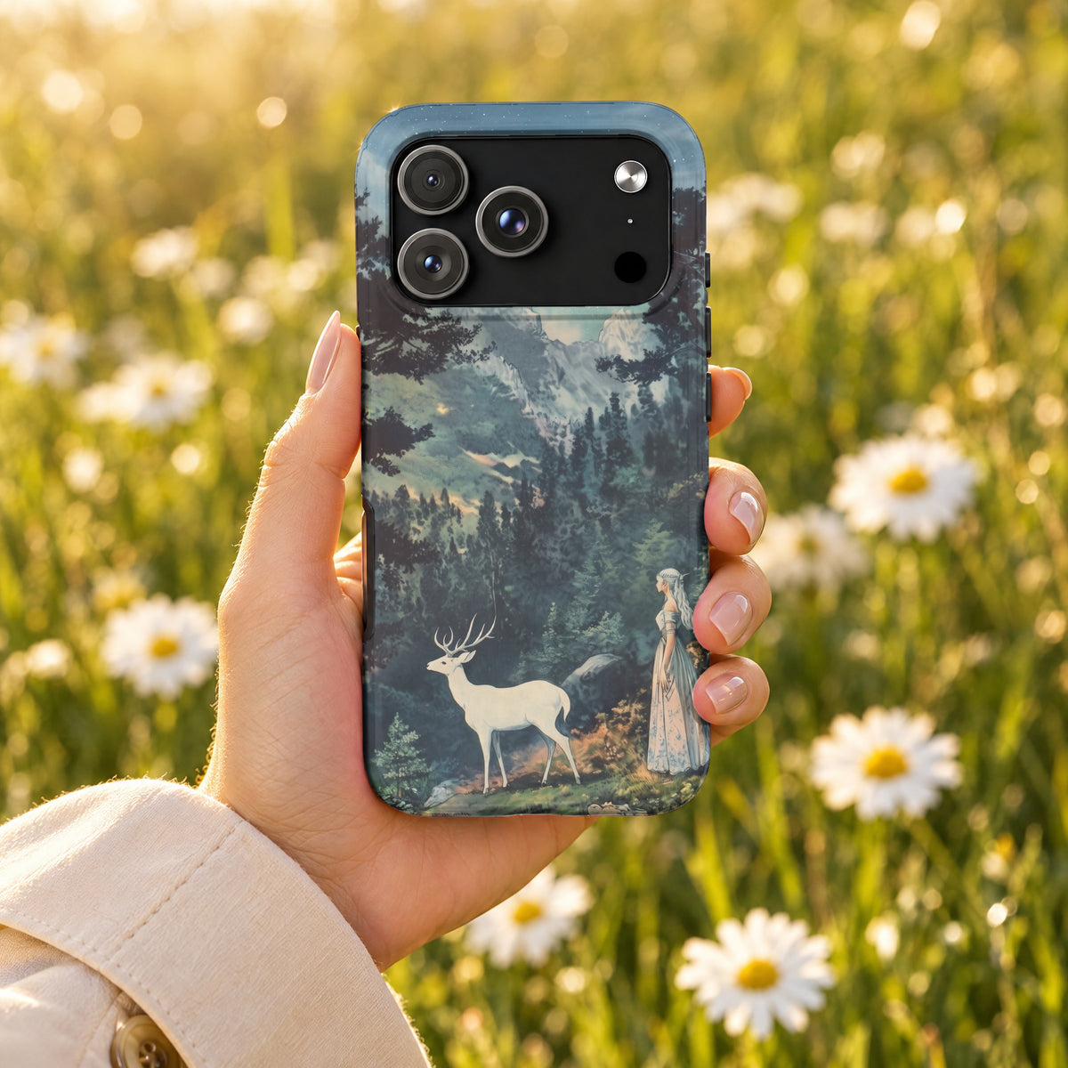 A hand holds a smartphone featuring a fantasy mountain landscape case against a blurry daisy field background.
