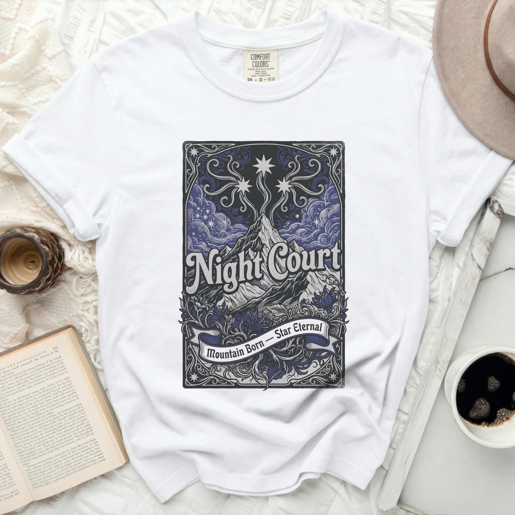White t-shirt with "Night Court Mountain Born Star Eternal" text.