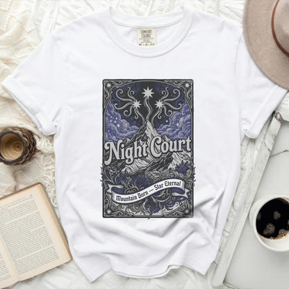 White t-shirt with "Night Court Mountain Born Star Eternal" text.
