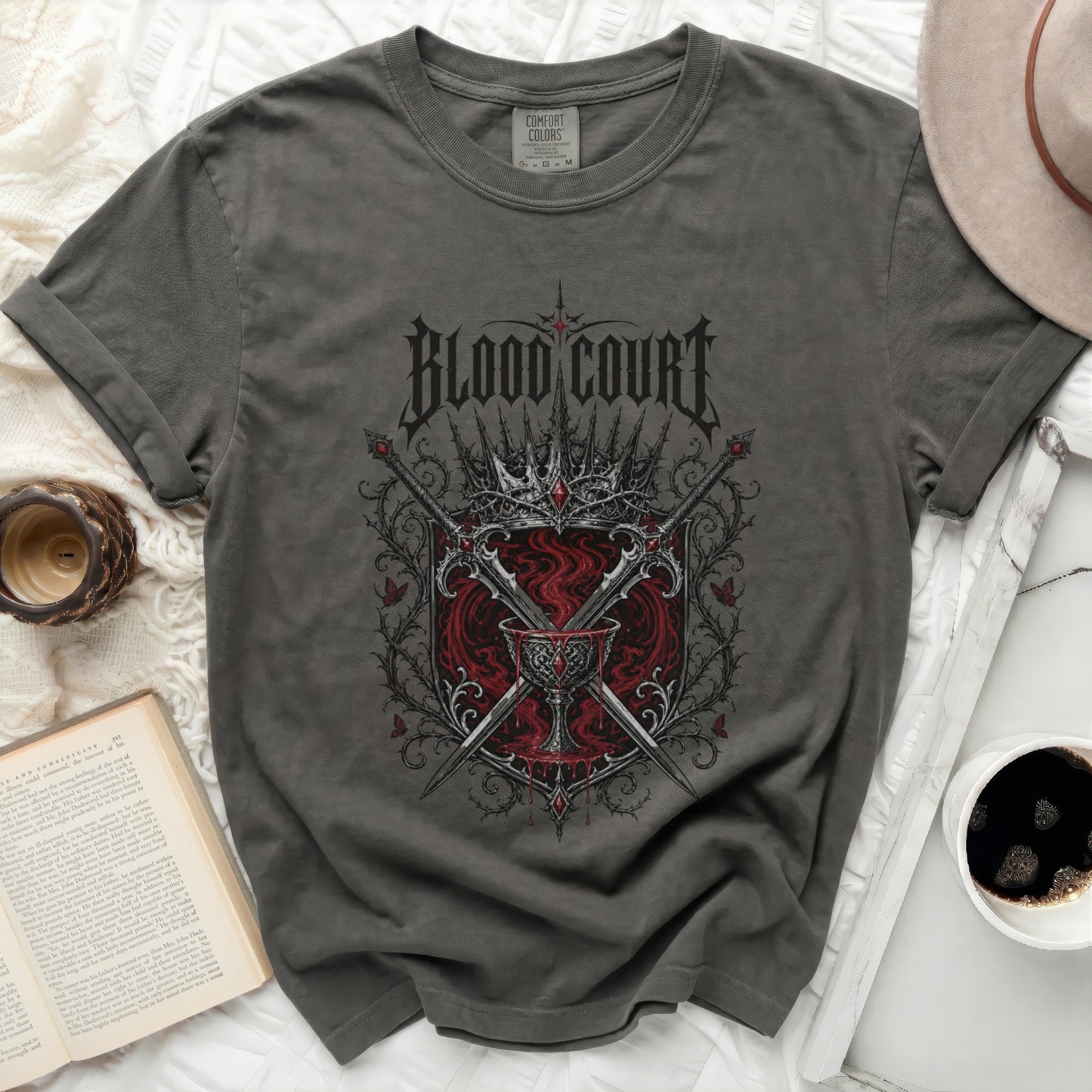 Dark t-shirt with "Blood Court" text, crown, swords, and goblet design.