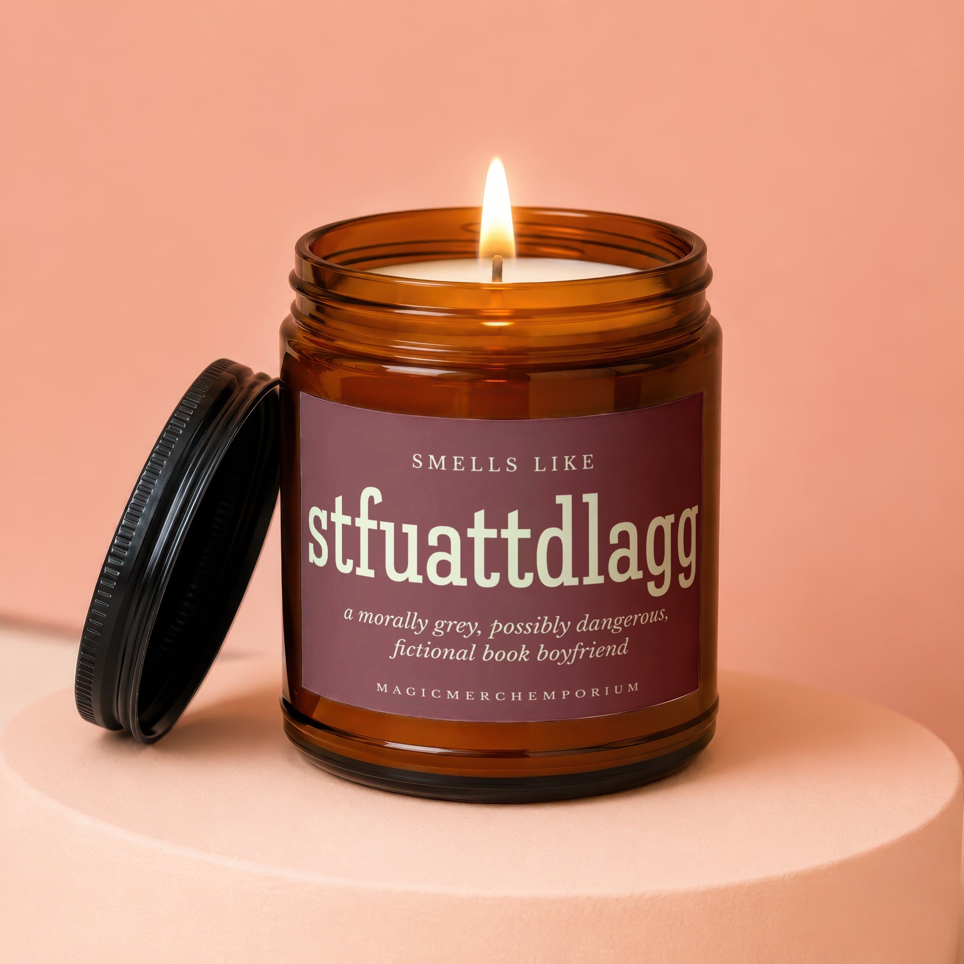 Candle with text: "Smells Like stfuattdlagg, a morally grey, possibly dangerous, fictional book boyfriend."