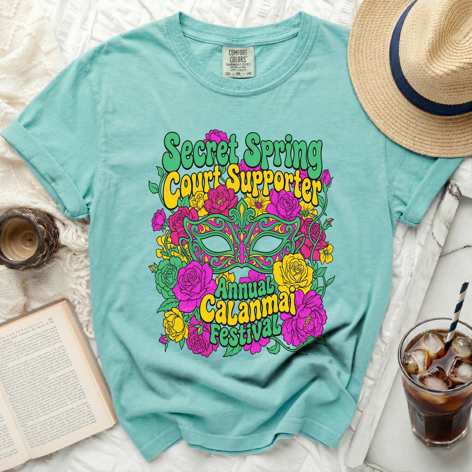 Teal t-shirt with "Secret Spring Court Supporter Annual Calanmai Festival" graphic.
