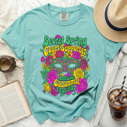 Teal t-shirt with "Secret Spring Court Supporter Annual Calanmai Festival" graphic.