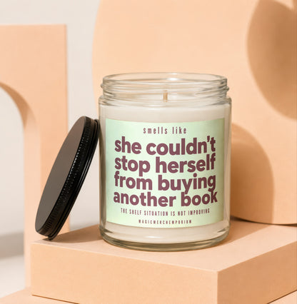 Candle with text: "smells like she couldn't stop herself from buying another book"