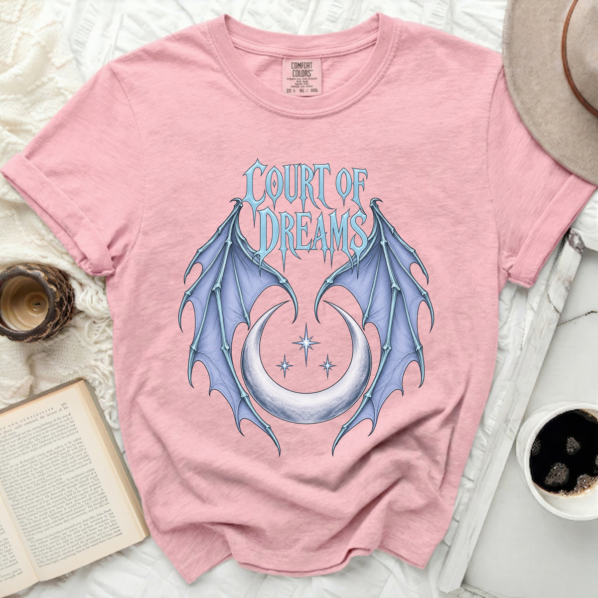 Pink t-shirt with "Court of Dreams" text and blue bat wings with crescent moon graphic.