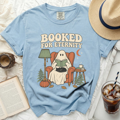 Light blue t-shirt with ghost reading a book and "Booked For Eternity" text.