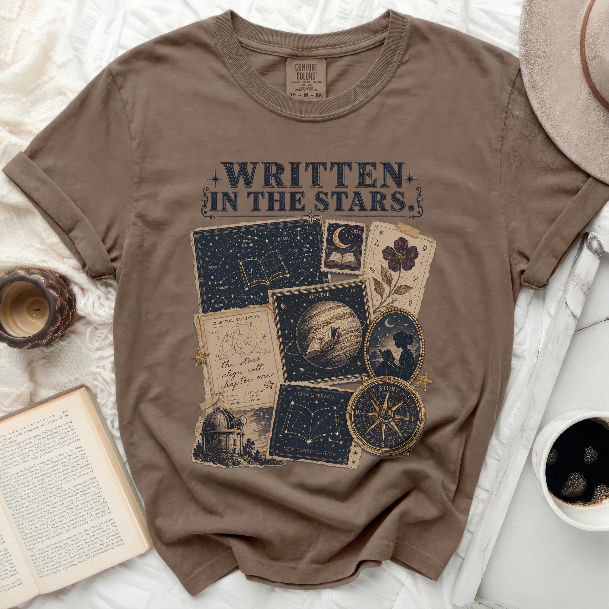 Brown t-shirt with "WRITTEN IN THE STARS" and celestial map designs.