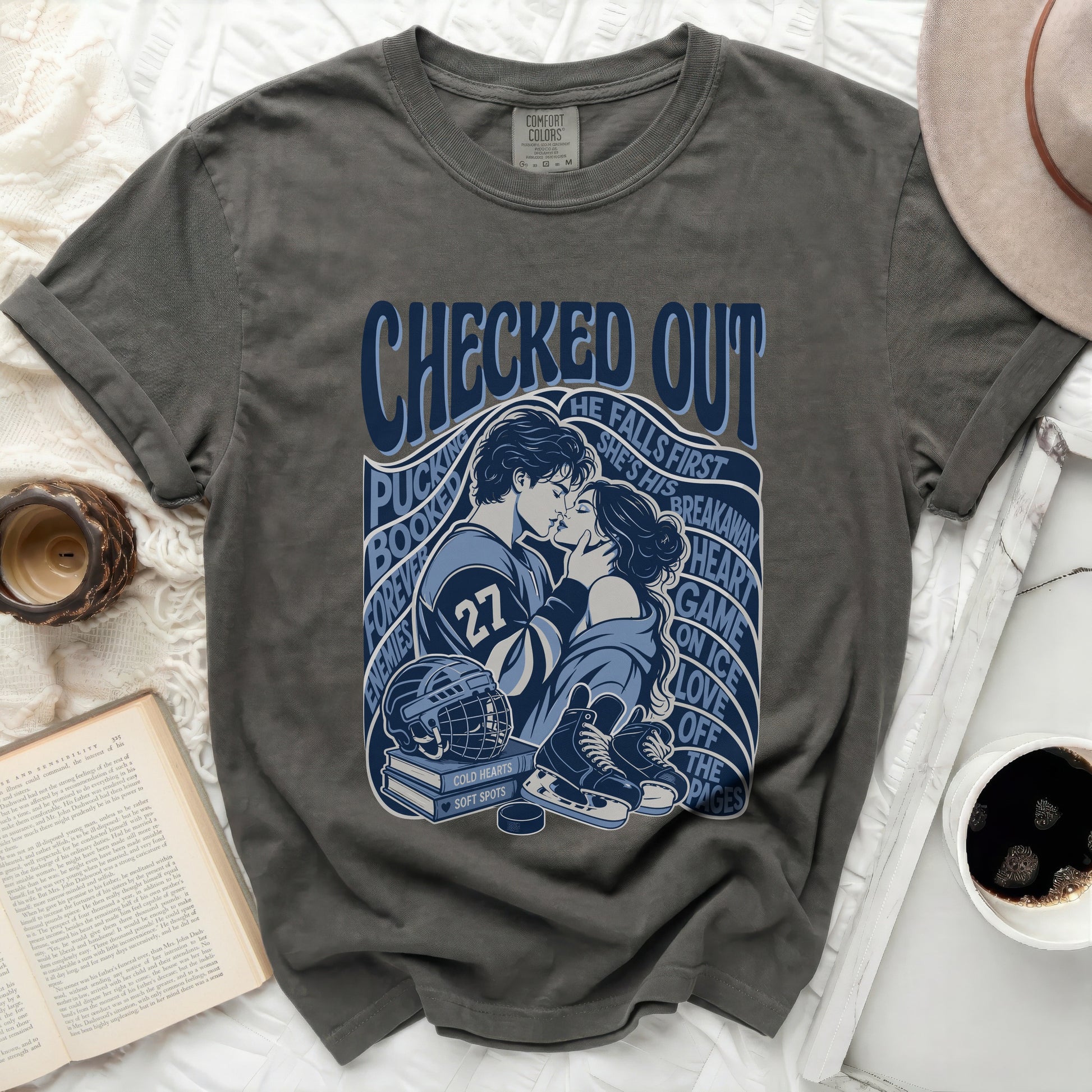 Dark gray t-shirt with hockey-themed graphic of kissing couple and text.