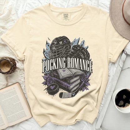 Cream t-shirt with "Pucking Romance" text and hockey graphics.