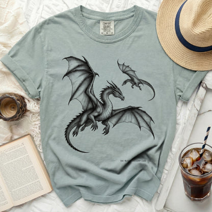 Dusty blue t-shirt with a large dragon and smaller dragon illustration.