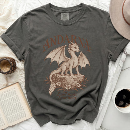 Grey t-shirt with a dragon graphic, "ANDARNA," and text "Small wings, brave heart."