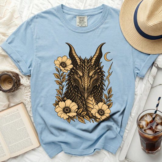 Light blue t-shirt with a gold and black dragon and floral graphic.