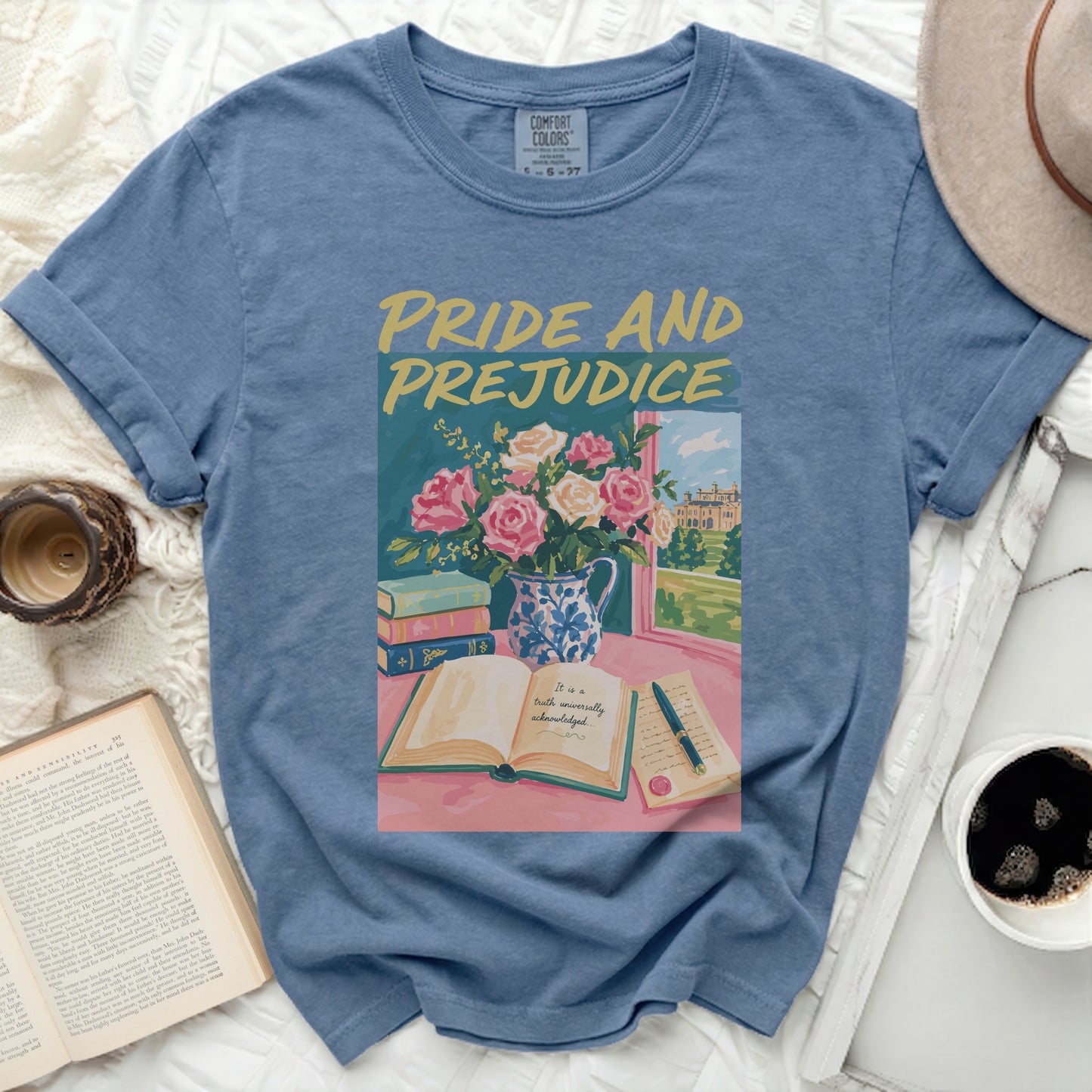Blue t-shirt with Pride and Prejudice book, flowers, and text graphic.