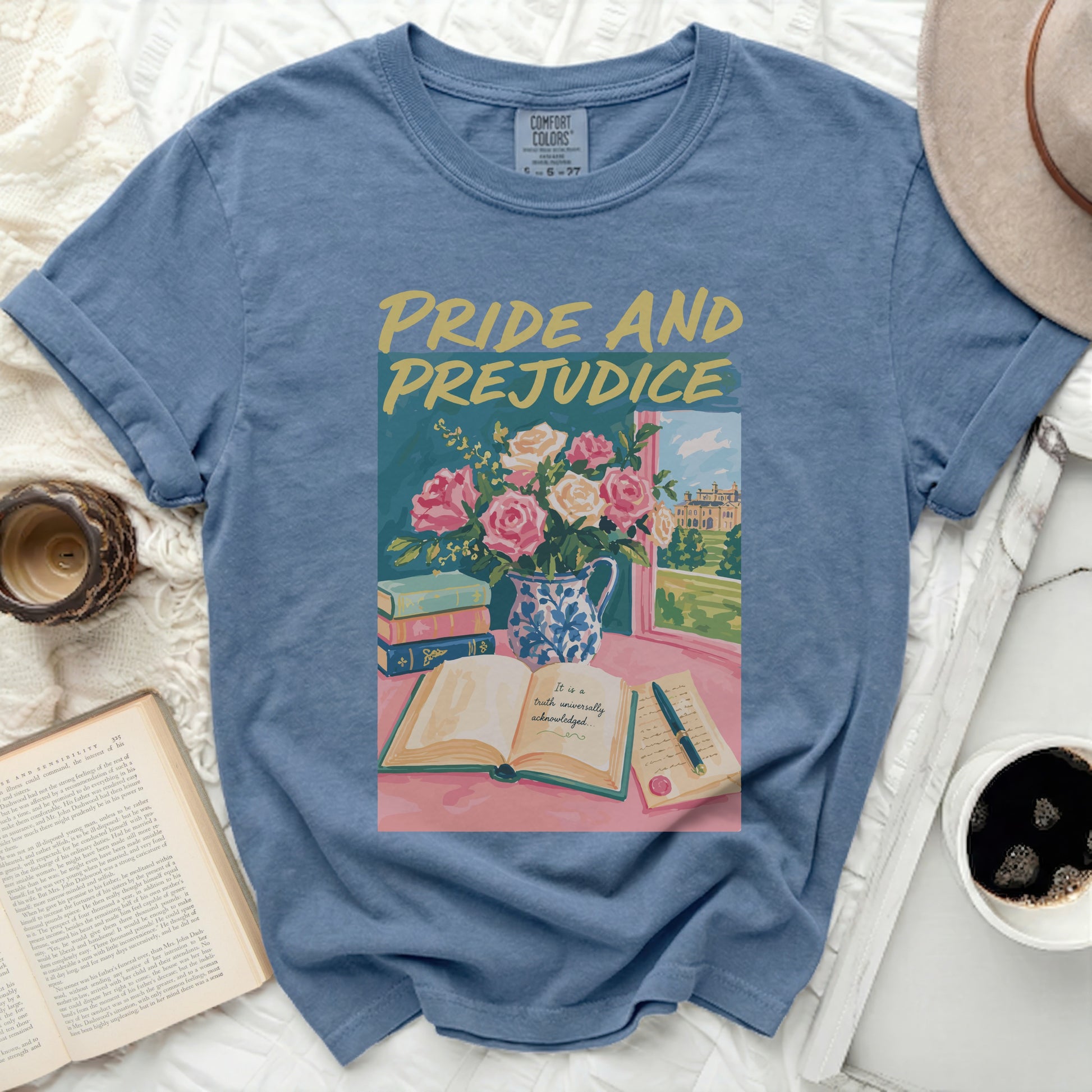 Blue t-shirt with Pride and Prejudice book, flowers, and text graphic.