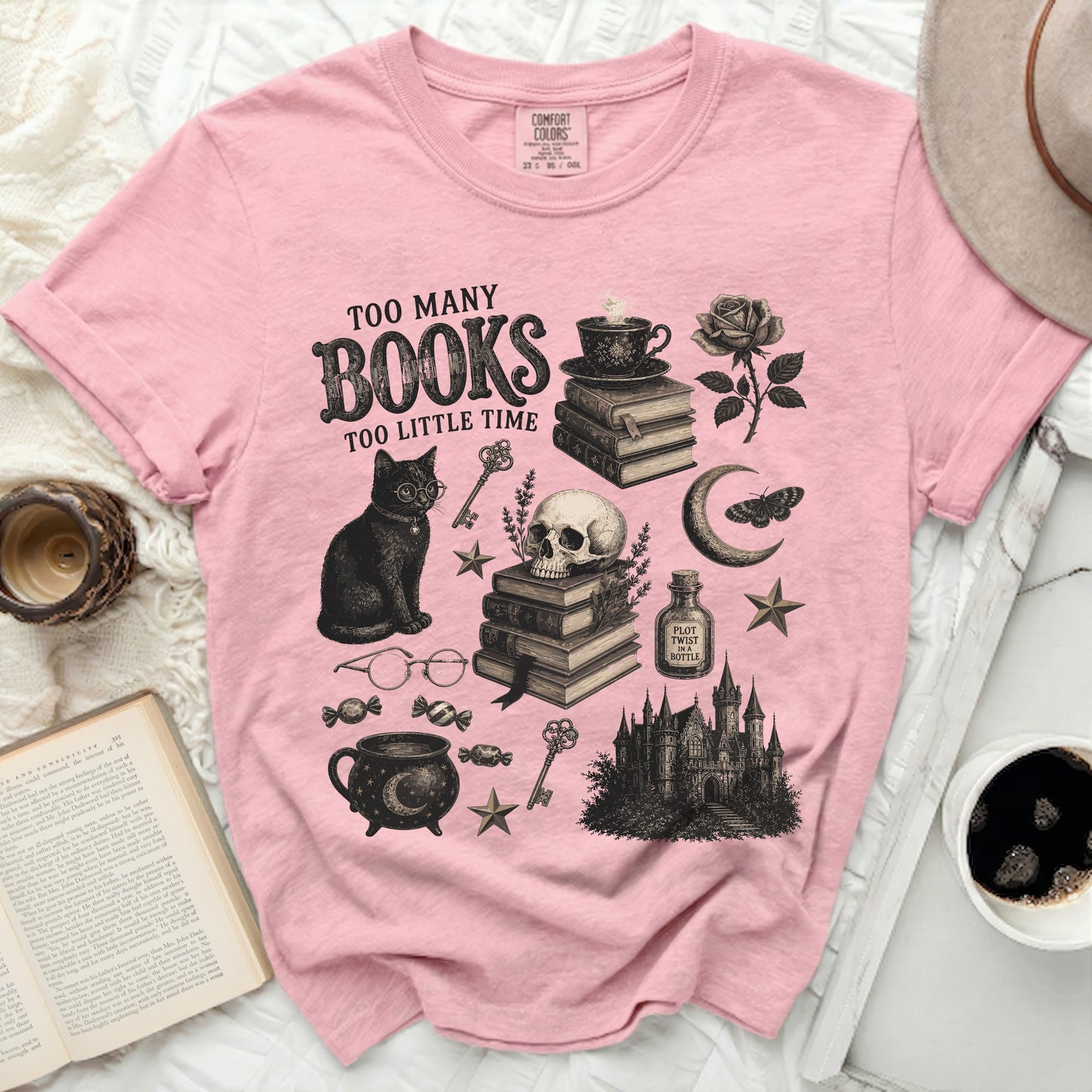 Pink t-shirt with "Too Many Books Too Little Time" graphic.