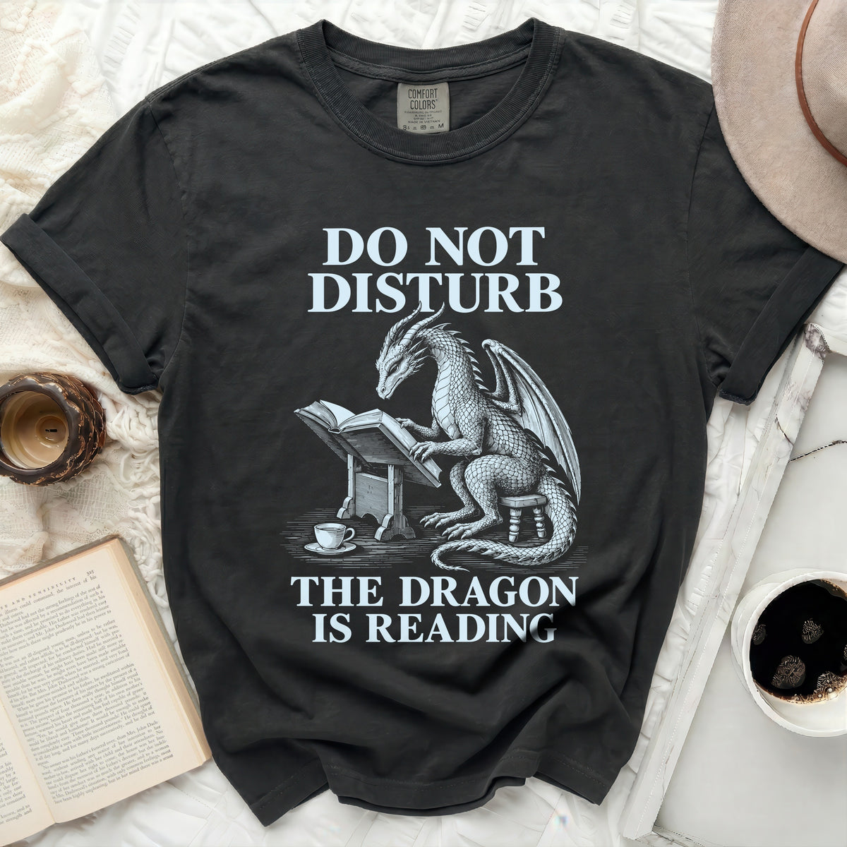 T-shirt with dragon reading a book, text "DO NOT DISTURB THE DRAGON IS READING".