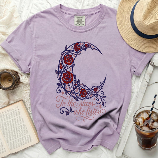 Lavender t-shirt with moon and rose design and text "To the stars who listen".
