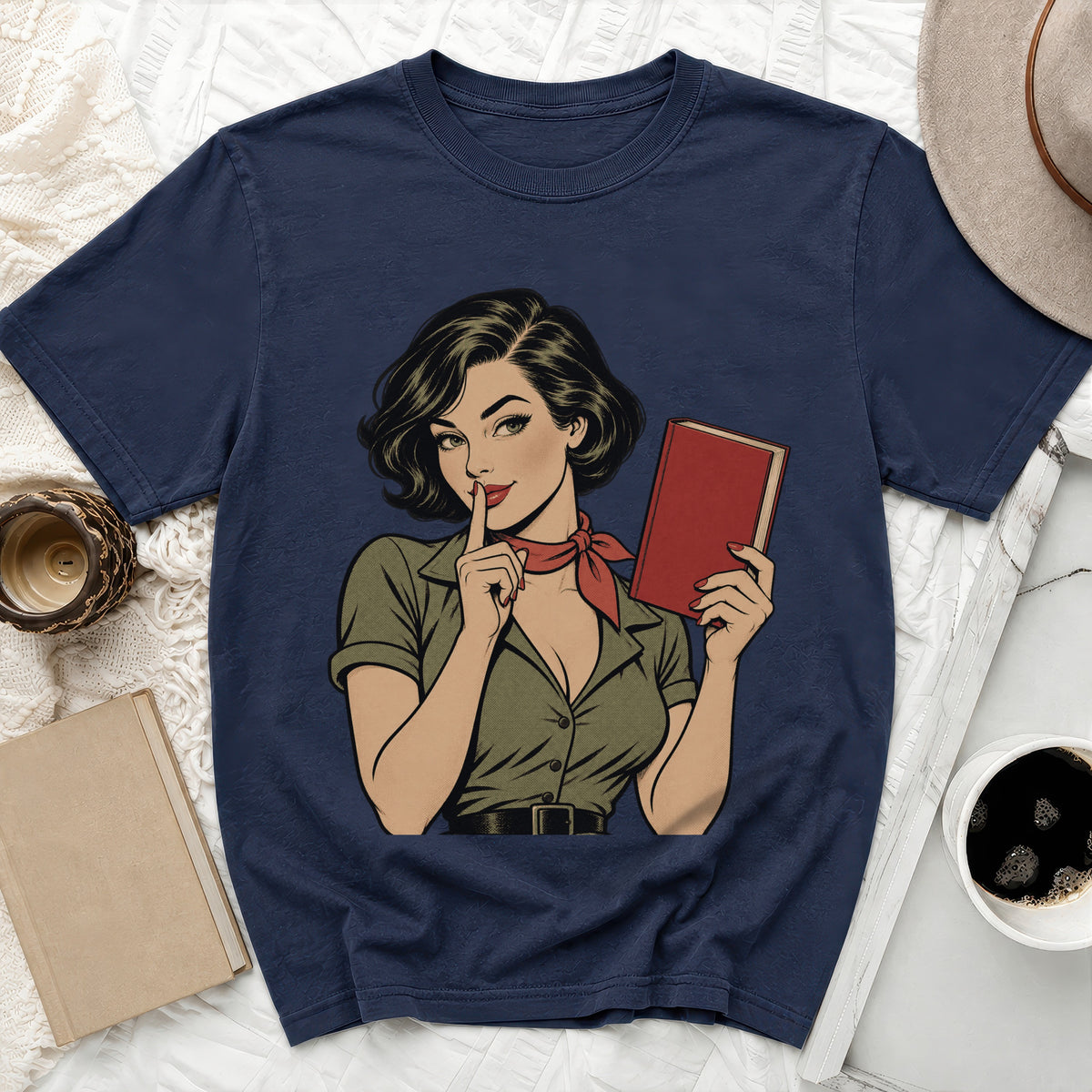 T-shirt with comic-style illustration of a woman holding a red book.