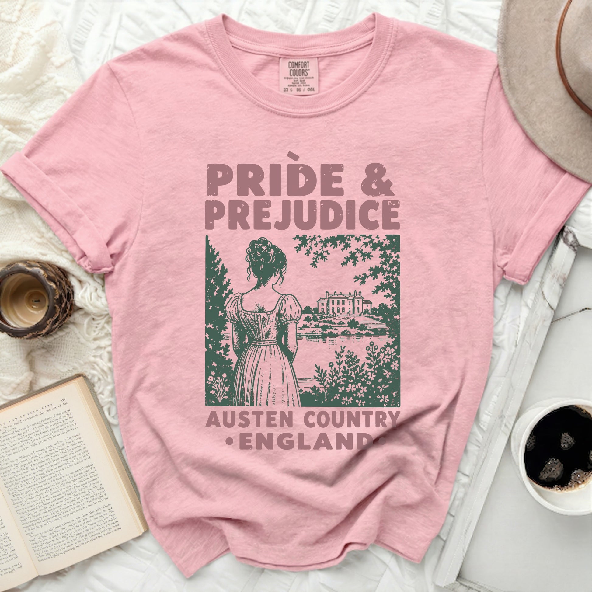 Pink t-shirt with "Pride & Prejudice Austen Country England" graphic.