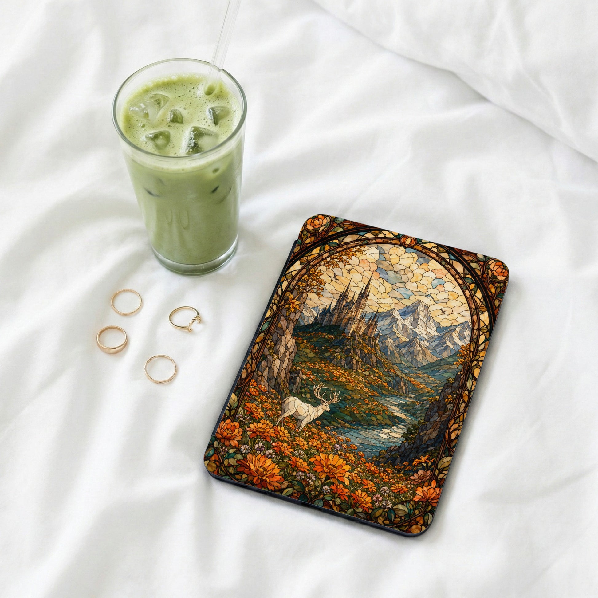 Tablet cover with stained glass art of a castle and a white stag.